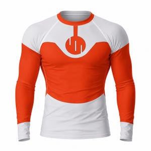 May include: A long-sleeved athletic shirt in white and orange. The shirt features a white upper body and sleeves, with orange panels on the torso and sleeves. A circular design with vertical lines is on the chest. The shirt has a crew neck and is designed for athletic activities.