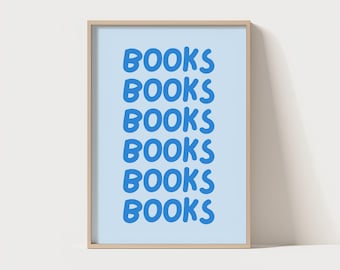May include: A framed art print with the word "BOOKS" repeated six times in a bold, blue font. The background is a light blue, and the frame is a natural wood color. The print is a simple, modern design.