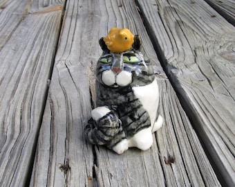 Gray Striped Tabby Cat Rattle with Little Yellow Bird