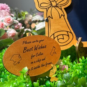 Wooden guest book alternative shaped as monogram C for a graduation party celebration