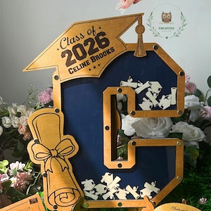 Initial letter graduation guestbook used as grad party sign in decor centerpiece