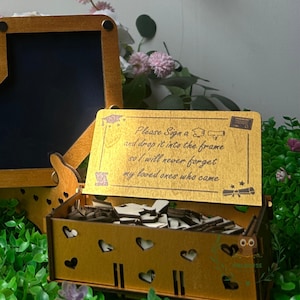 Custom grad guestbook drop box displayed with cap and diploma decor details