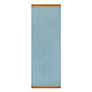 May include: A rectangular, light blue rug with a textured surface. The rug has a brown fringe along the top and bottom edges. The rug is displayed vertically against a white background.