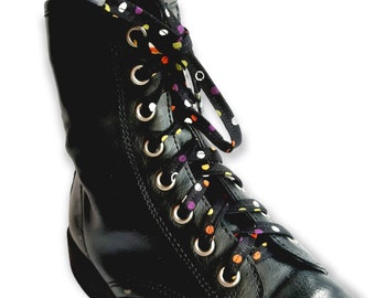 May include: Black leather boots with colorful polka dot shoelaces. The laces are black with white, orange, yellow, and purple polka dots.