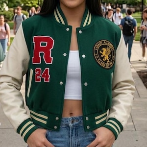 May include: Green and cream varsity jacket with the text "R 24" and a circular patch that reads "Legacy Academy Class of '24". The jacket has a button-up front and striped detailing on the cuffs and collar.