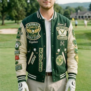 May include: A green and cream varsity jacket with multiple patches, including "Fairway Eagles Golf Club" and "Valley Open 2024 Champion." The jacket has white stripes on the collar and cuffs, and the sleeves are cream-colored.