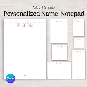 May include: A white personalized name notepad with a pink heart design. The notepad is available in multiple sizes and features the text "MULTI SIZED" and "Personalized Name Notepad". The name "emily william" is written in pink and gray.