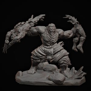 May include: A gray sculpture of a muscular figure, adorned with a beaded necklace and draped clothing, holding two other figures. One figure has claws extended. The sculpture is on a rocky base, with a dark background.