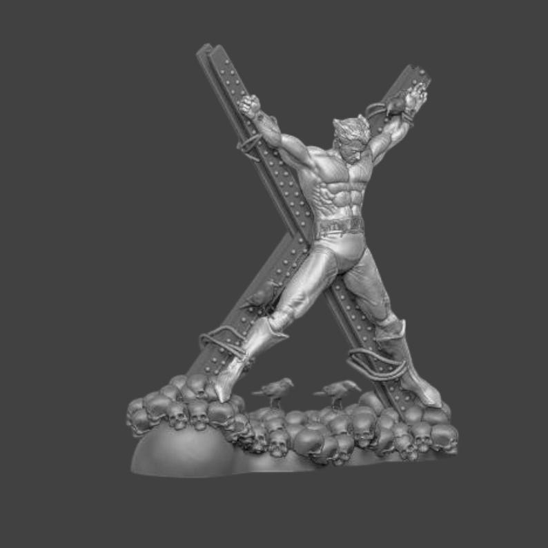May include: A grayscale sculpture of a muscular figure bound to a large X-shaped structure. The figure is positioned with arms outstretched, and the base is adorned with skulls. Two small bird figures are also present.