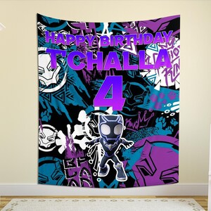 May include: A large wall tapestry with a colourful design featuring the text "HAPPY BIRTHDAY T'CHALLA 4". The tapestry has a black, blue, and purple background with a cartoon figure of Black Panther.