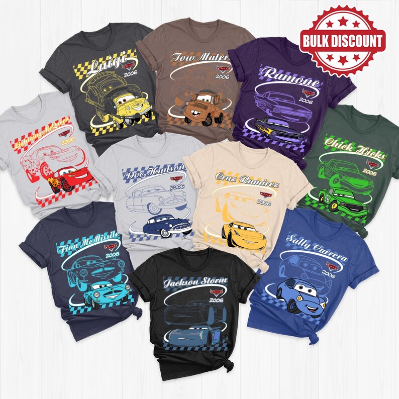 May include: A collection of ten short-sleeved t-shirts featuring various characters from the movie Cars, including Lightning McQueen, Tow Mater, Ramone, Chick Hicks, Doc Hudson, Cruz Ramirez, Finn McMissile, Sally Carrera, and Jackson Storm.