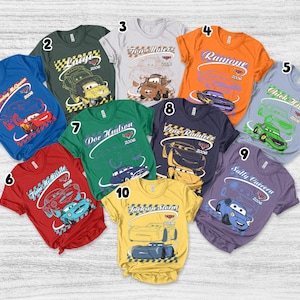 May include: A collection of ten short-sleeved t-shirts in various colors, each featuring a unique character from the movie Cars, including Lightning McQueen, Luigi, Tow Mater, Ramone, Chick Hicks, Finn McMissile, Doc Hudson, Cruz Ramirez, Sally Carrera, and Jackson Storm.