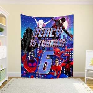May include: A rectangular wall tapestry featuring a vibrant Spider-Verse themed graphic with multiple characters, a large blue number 6, and the text PERCY IS TURNING in bold blue and red lettering against a dark blue city skyline background.