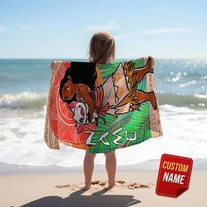 May include: A colorful beach towel featuring a cartoon illustration of a woman with long black hair and a pig. The towel has a red, orange, and green design with the word "NAME" in white. A red sticker with the words "CUSTOM NAME" is in the bottom right corner.