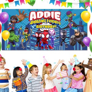 May include: A banner with the text "ADDIE AMAZING FRIENDS 3RD BIRTHDAY!" is displayed above a group of children. The banner features cartoon characters and is decorated with balloons in various colors.