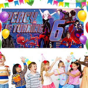 May include: A rectangular birthday banner featuring Spider-Man characters against a city skyline with the text Percy Is Turning 6. The banner is surrounded by colorful balloons and party bunting, with children wearing party hats below.