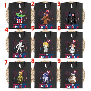 May include: Nine black t-shirts with various Star Wars characters wearing patriotic hats and holding fireworks. Each shirt has the text "Fourth of July America" in red, white, and blue.