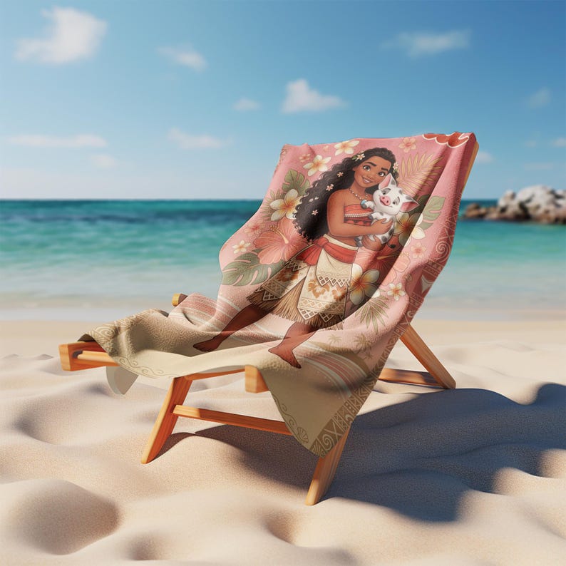 May include: A beach towel draped over a wooden lounge chair featuring a printed illustration of a long-haired character holding a small piglet. The design includes tropical flowers, palm leaves, and geometric patterns in shades of pink and tan.