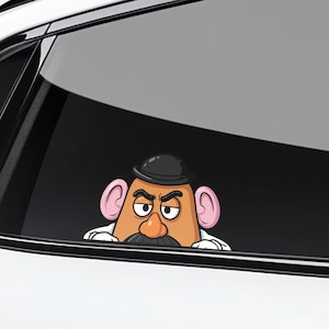 May include: A white ceramic mug with a black handle and the text "But First, Coffee" in a black, bold font. The mug is on a white surface. The mug is approximately 4 inches tall.