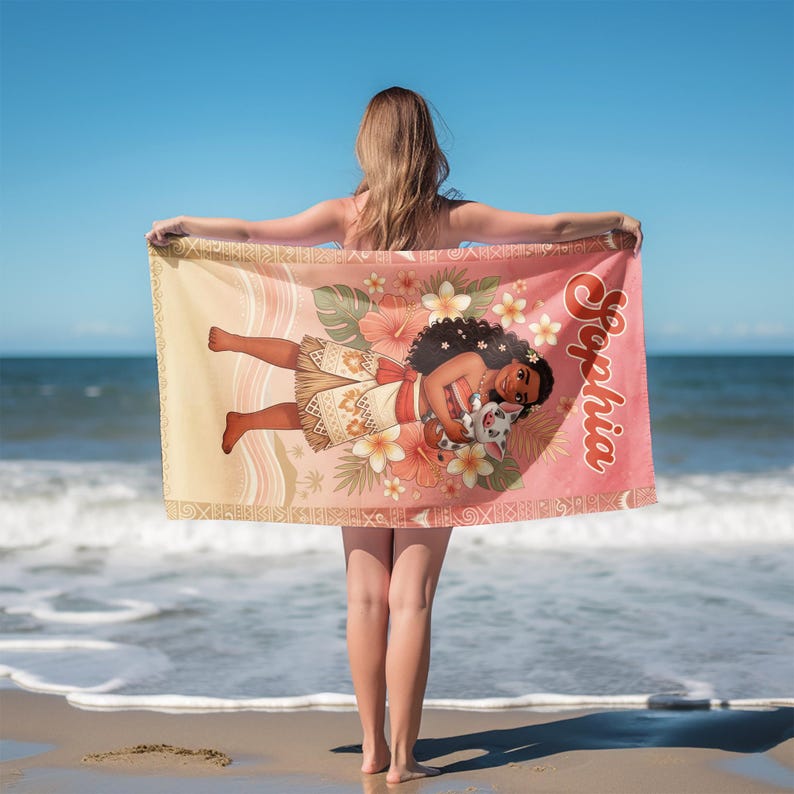 May include: A rectangular beach towel featuring a gradient background from light yellow to pink. The design includes a cartoon character with dark curly hair holding a small pig, surrounded by hibiscus flowers and the name Sophia in red script.