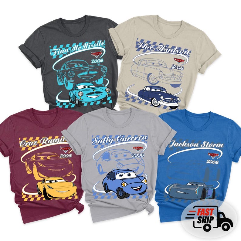 May include: Five short-sleeve t-shirts in charcoal, beige, maroon, gray, and blue, each featuring a character from the movie Cars. Designs include Finn McMissile, Doc Hudson, Cruz Ramirez, Sally Carrera, and Jackson Storm with their names and 2006.
