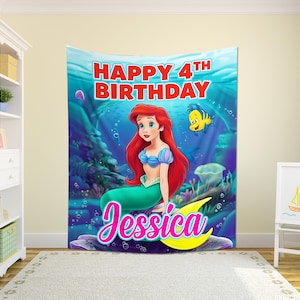 May include: A vibrant birthday banner with a mermaid illustration. The banner displays the text "Happy 4th Birthday Jessica" in pink and blue, with a cartoon fish. The mermaid has red hair and a green tail.