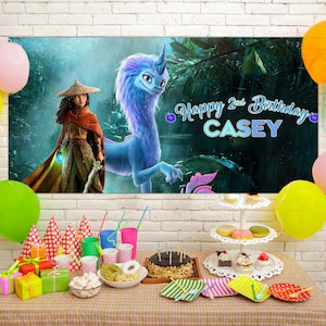 May include: A birthday party scene with a banner featuring characters from a fantasy movie. Colorful balloons, gifts, cupcakes, and a cake are arranged on a table. The banner reads "Happy 2nd Birthday CASEY".