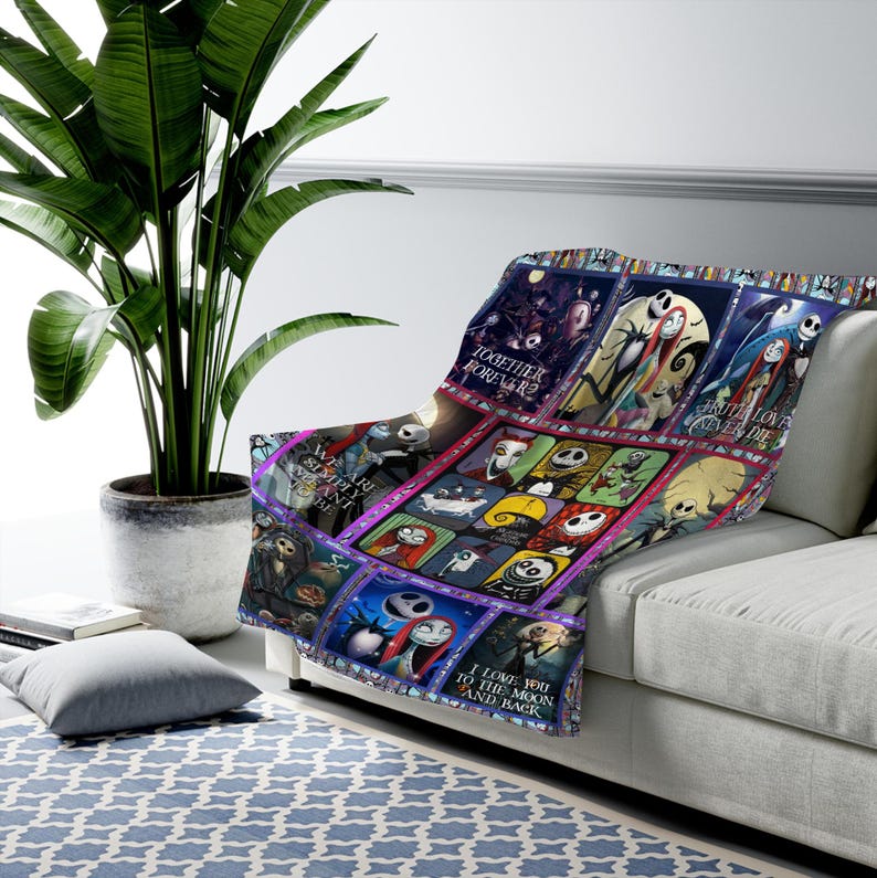 May include: A colorful throw blanket featuring images of characters from "The Nightmare Before Christmas." The blanket has a patchwork design with various scenes and character portraits. Text includes "Together Forever?" and "I Love You to the Moon and Back."