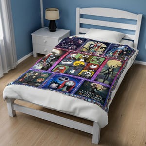 May include: A white bed with a patterned blanket featuring characters from The Nightmare Before Christmas. The blanket has a grid design with various character portraits and phrases like "Together Forever" and "I Love You to the Moon and Back."
