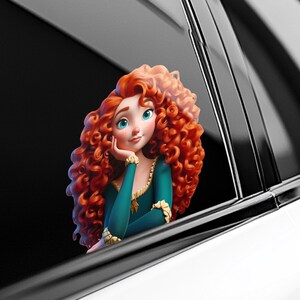 May include: A car window decal featuring a cartoon character with vibrant red curly hair, blue eyes, and a teal dress with gold accents. The character is leaning on their hand, appearing to be looking out the window.