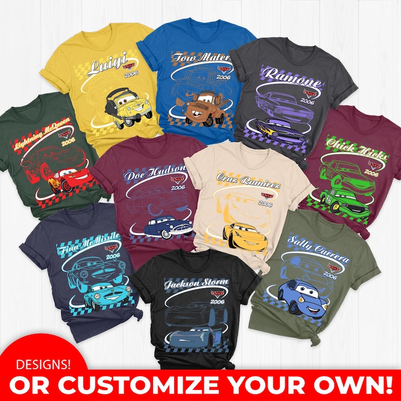 May include: A collection of ten t-shirts in various colors, each featuring a character from the movie Cars, including Lightning McQueen, Tow Mater, and others. Each shirt displays the character name, the year 2006, and a checkered pattern.