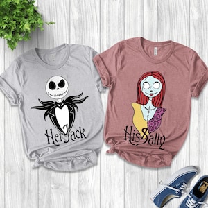 May include: Two t-shirts with graphic designs from The Nightmare Before Christmas. One is light gray with Jack Skellington and the text "Her Jack". The other is mauve with Sally and the text "His Sally".