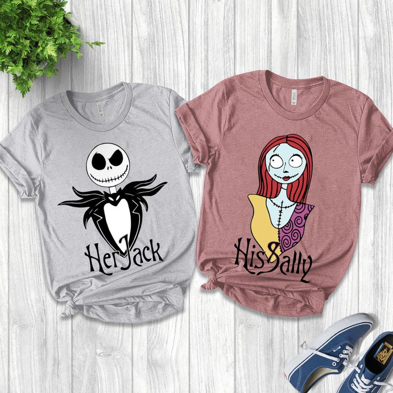 May include: Two t-shirts with graphic designs from The Nightmare Before Christmas. One is light gray with Jack Skellington and the text "Her Jack". The other is mauve with Sally and the text "His Sally".