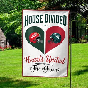 May include: A white garden flag with the text "HOUSE DIVIDED" above a heart split into green and red halves. Each half features a football helmet and the word "LOGO". Below, it reads "Hearts United" and "The Greens".
