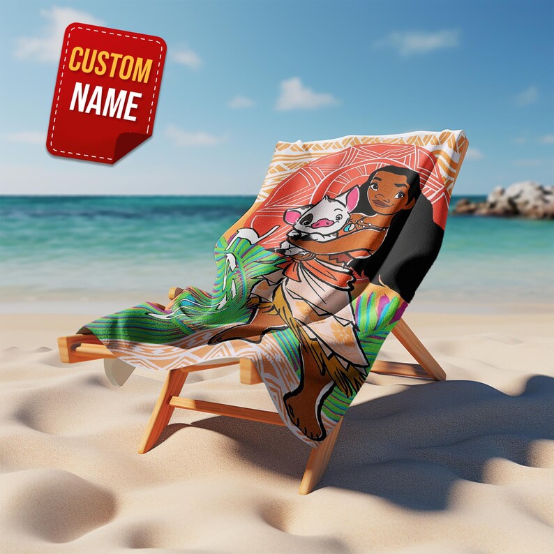 May include: A beach chair with a colorful towel featuring a cartoon character design. The towel has a vibrant illustration of a character with a pig. The chair is on a sandy beach with the ocean in the background. A red tag with the text "CUSTOM NAME" is in the upper left.