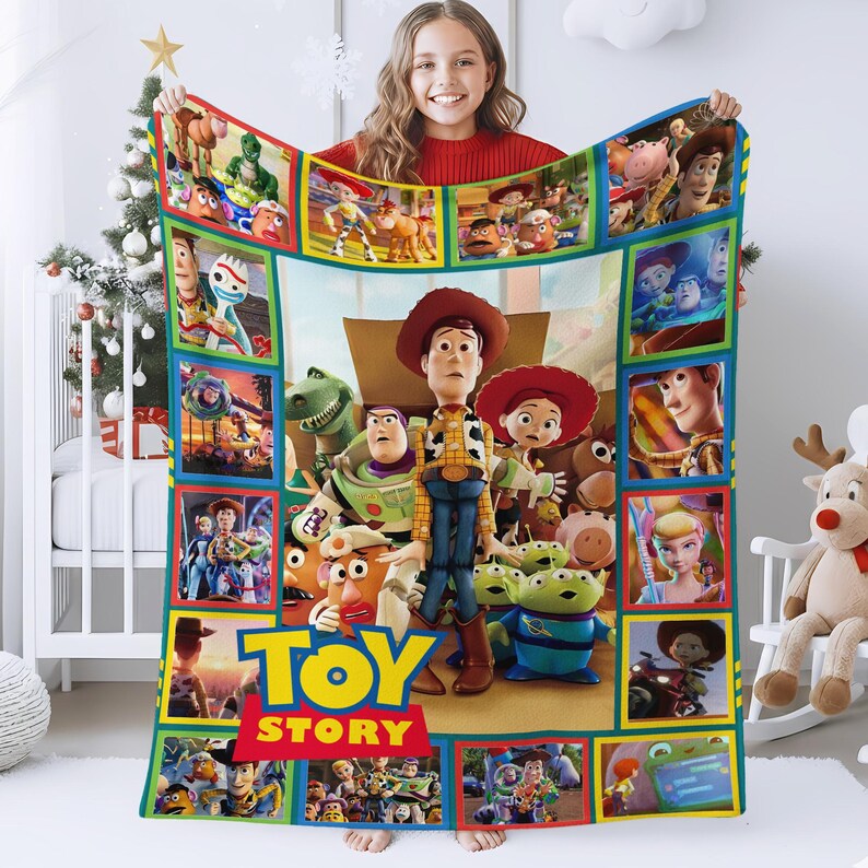 May include: A rectangular fleece blanket featuring a collage of various Toy Story characters including Woody, Buzz Lightyear, Jessie, and the Aliens. The blanket has a large Toy Story logo at the bottom and is framed by a colorful border of smaller scenes.