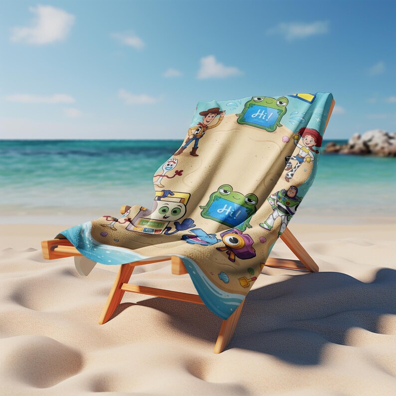 May include: A beach chair with a colorful beach towel featuring Toy Story characters. The towel has a sand-colored background with images of Woody, Buzz Lightyear, and other characters. The chair is made of wood and is set on a sandy beach with the ocean in the background.