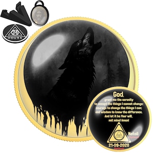 May include: A round gold-rimmed medallion featuring a black silhouette of a wolf howling at a moon. A smaller circular insert displays the Serenity Prayer text, a triangle symbol with the number 24, and the date 21-09-2020 with the name Natali.