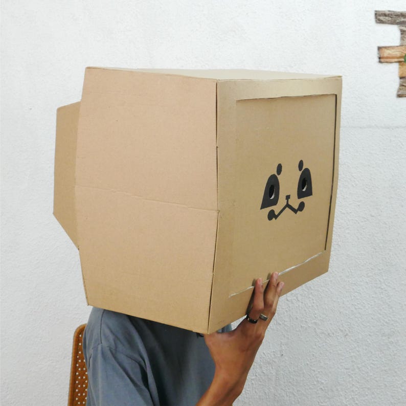 A person wearing a TV head helmet, similar to what players might wear in a virtual reality banana ball game, emphasizing the futuristic and tech-savvy aspect of banana ball milwaukee tickets