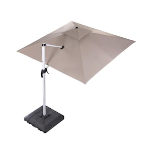 May include: A beige cantilever patio umbrella with a square canopy and a black base. The umbrella is tilted to the side.