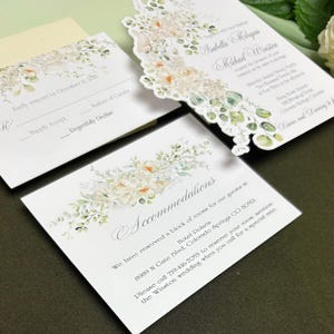 die cut wedding invitation featuring beautiful florals and doves. The invitation has a decorative border