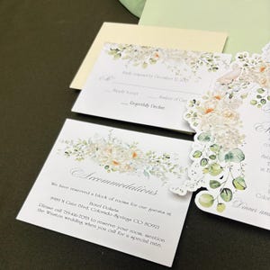 Accommodations cards with Alabaster flowers and coordinating RSVP card