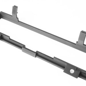 May include: A dark gray rectangular plastic frame with a hollow center. The frame has several protruding tabs and circular holes. The object is set against a white background.