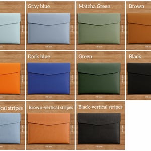 May include: A collection of leather document cases in various colors, including lake blue, gray blue, matcha green, brown, orange, dark blue, green, and black. Each case is rectangular with a flap closure and measures 130 mm x 240 mm.