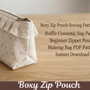 May include: A boxy zip pouch with a ruffle detail, made from cream fabric with a small floral print. The text reads: Boxy Zip Pouch Sewing Pattern PDF, Ruffle Cosmetic Bag Pattern, Beginner Zipper Pouch, Makeup Bag PDF Pattern, Instant Download, Boxy Zip Pouch.