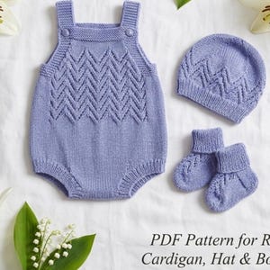 May include: A light purple knitted baby set, including a romper, hat, and booties. The set features a chevron pattern and is displayed on a white surface with floral accents. The text "PDF Pattern for Romper, Cardigan, Hat & Booties" is visible.