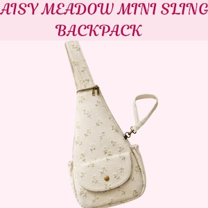 May include: A cream-colored mini sling backpack featuring a delicate daisy meadow floral pattern. The bag includes a single shoulder strap, a top zipper closure, and a front pocket with a flap and a single brass-toned snap button closure.