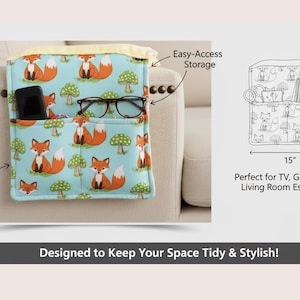 May include: A blue fabric sofa arm organizer with a repeating pattern of orange foxes and green mushrooms. The organizer has pockets for storage and is 15 inches wide and 15 inches tall. The text "Designed to Keep Your Space Tidy & Stylish!" is at the bottom.