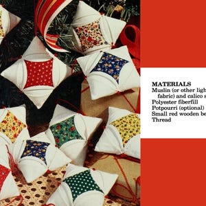 May include: A collection of square fabric ornaments featuring white muslin borders and central calico patches in red, blue, yellow, and green floral patterns. Each ornament is accented with a small red wooden bead and includes text listing materials like muslin, calico scraps, polyester fibre-fill, pot-pourri, and thread.