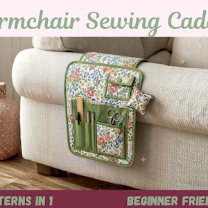 May include: An armchair sewing caddy featuring a floral pattern with red, blue, and green tones. It includes multiple pockets, a small flap-covered compartment, and a square pin cushion. The caddy is trimmed in green and hangs over an armrest.